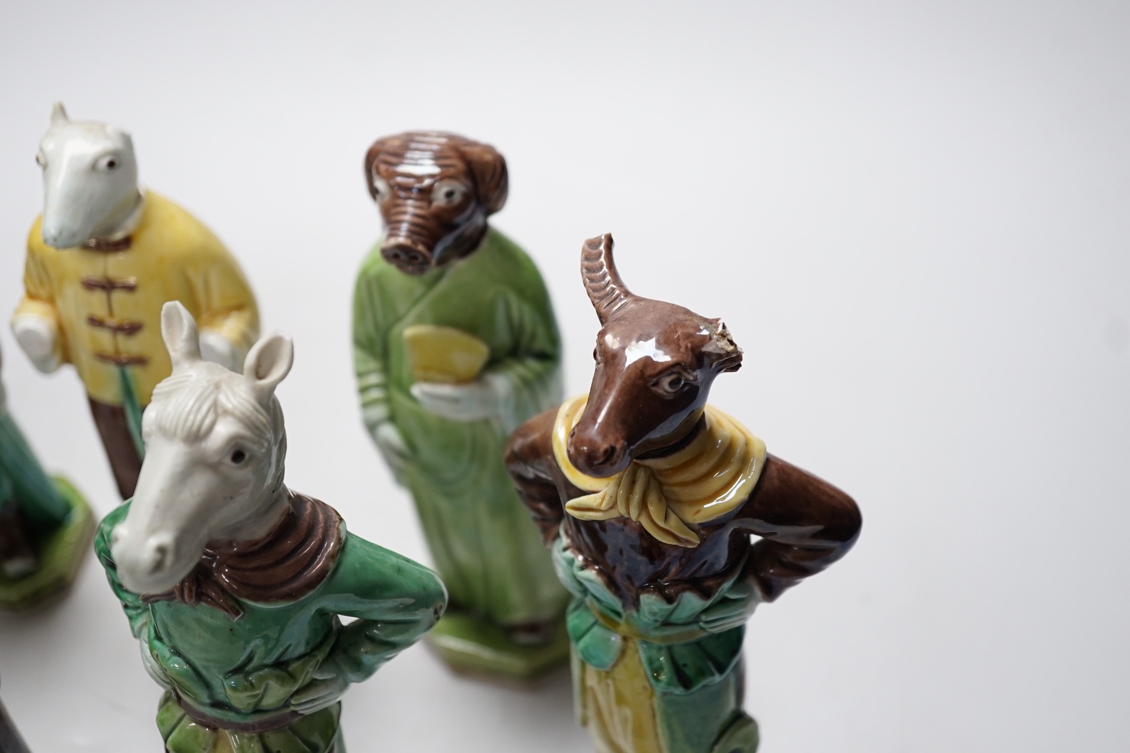 Ten Chinese Sancai glazed biscuit animal headed figures, tallest 17cm